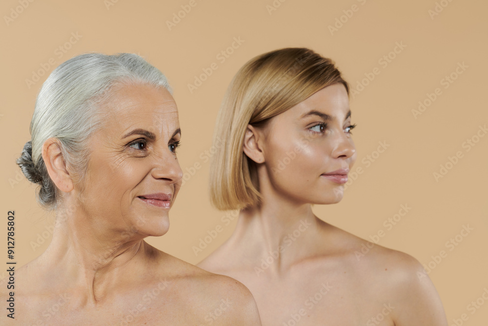 A mature woman stands with her adult daughter, sharing a joyful connection. A mature woman stands with her adult daughter, sharing a joyful connection.