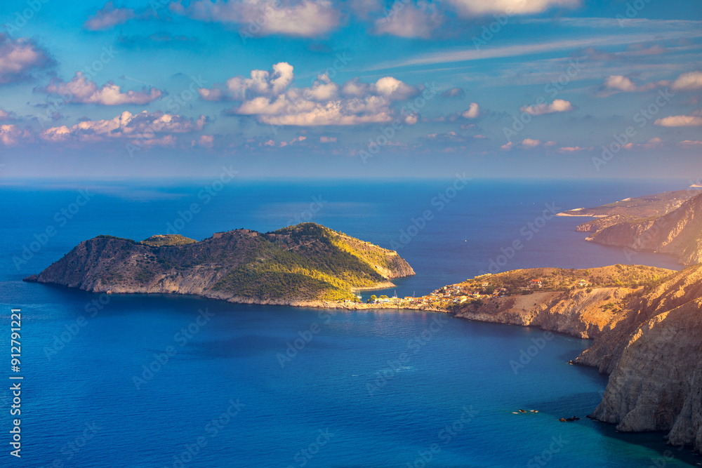 Fototapeta premium Aerial drone view video of beautiful and picturesque colorful traditional fishing village of Assos in island of Cefalonia, Ionian, Greece. Peninsula of Assos in Cephalonia (Kefalonia), Greece