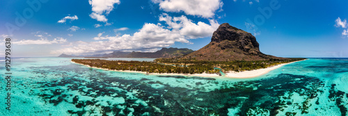 Beach with palm trees and umbrellas on Le morne beach in Mauriutius. Luxury tropical beach and Le Morne mountain in Mauritius. Le Morne beach with palm trees, white sand and luxury resorts, Mauritius photo