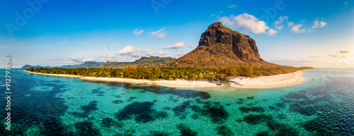 Aerial view of Le morne Brabant in Mauriutius. Tropical crystal ocean with Le Morne mountain and luxury beach in Mauritius. Le Morne beach with palm trees, white sand and luxury resorts, Mauritius. photo