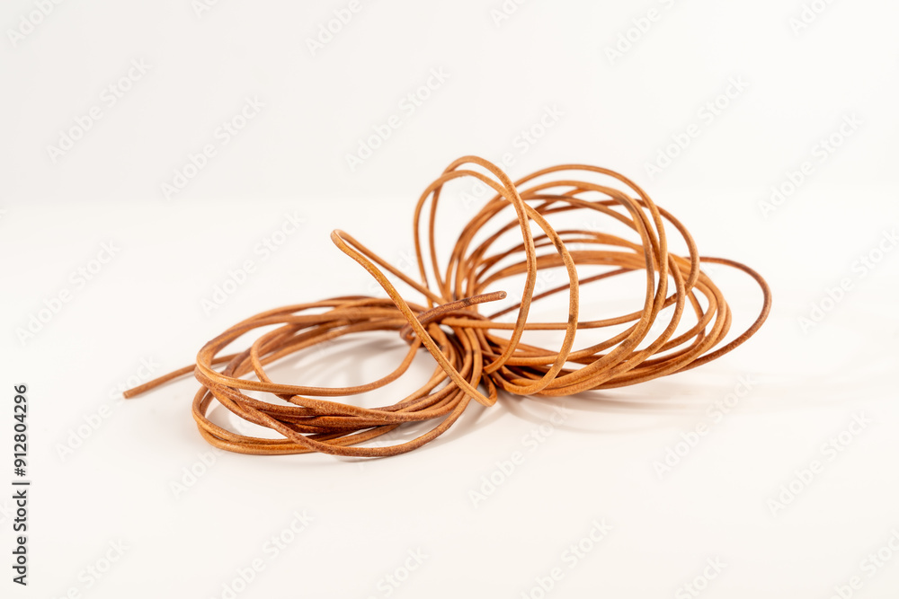 roll of natural tanned leather cut into fine strips for laces bracelets and crafting roll of natural tanned leather cut into fine strips for laces bracelets and crafting