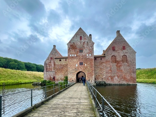 Spøttrup Castle built of red brick, is an ancient building surrounded by beautiful scenery in Central Jutland, Denmark. photo