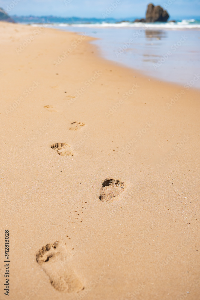 Footprints on the sandy beach. Footsteps in soft sand. Footprints on the sandy beach. Footsteps in soft sand.