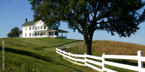 Quaint farmhouse with a white picket fence photo