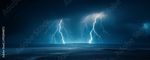 Blue sky with three lightning bolts in the center, each one striking down from top to bottom, illuminating dark clouds above and below it. The background is clear against the night sky