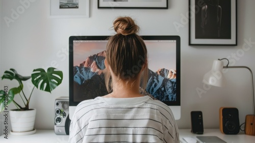 Over-the-shoulder view of a computer screen with a video conference.