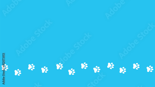 Trail of dog or cat paw prints on a blue background.  Steps tracing the path. Copy space background with the pet foot. Animal or pet theme seamless pattern backdrop.