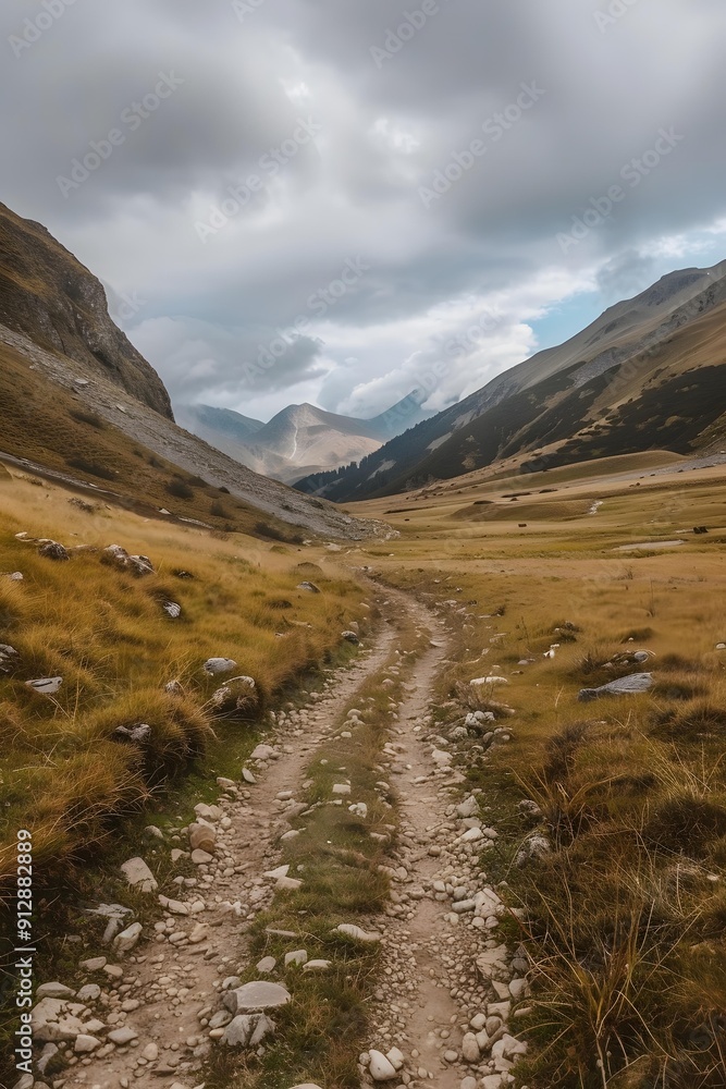 Mountain Path Through Valley With Cloudy Sky Mountain Path Through Valley With Cloudy Sky