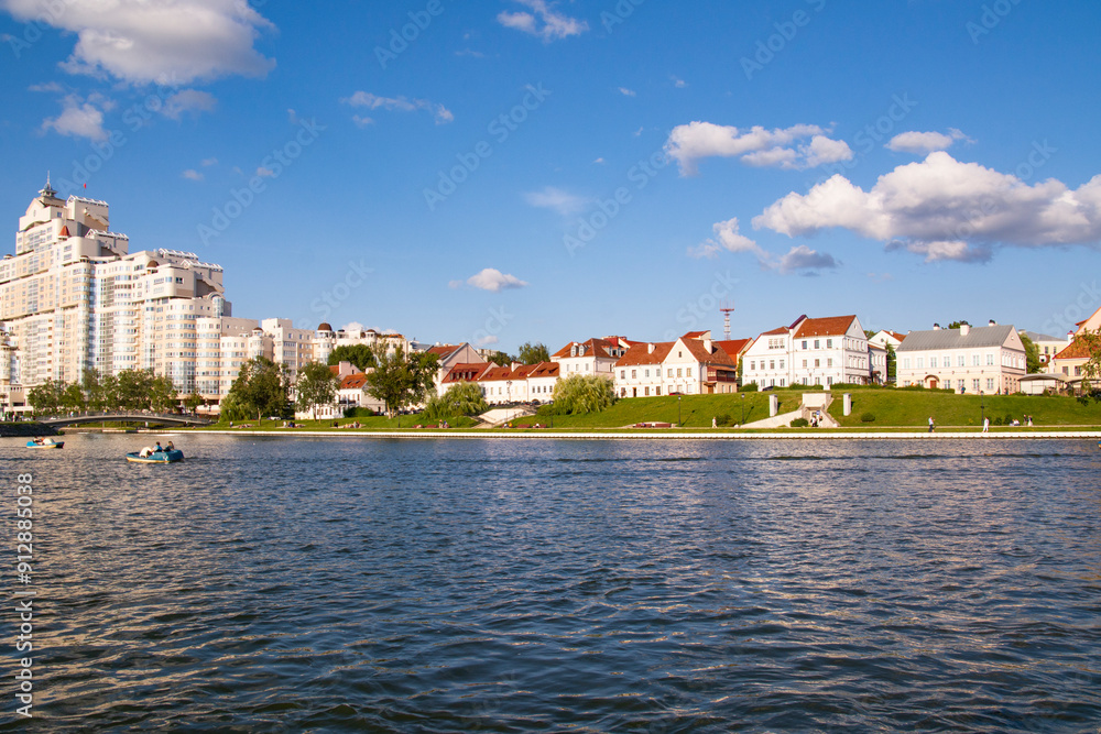 Fototapeta premium Minsk, Belarus - August 01, 2024: View of the Svislach River and Trinity Suburb