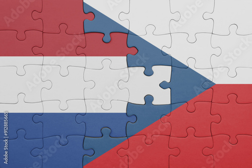 puzzle with the colourful national flag of czech republic and flag of netherlands. photo