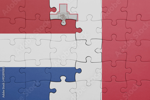 puzzle with the colourful national flag of malta and flag of netherlands.