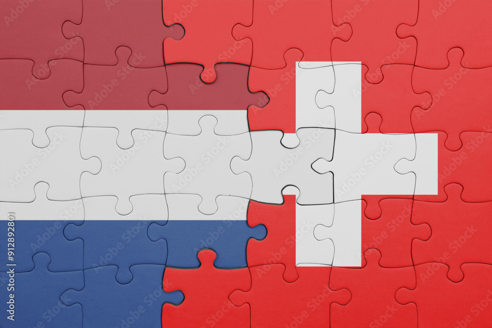 puzzle with the colourful national flag of switzerland and flag of netherlands. puzzle with the colourful national flag of switzerland and flag of netherlands.