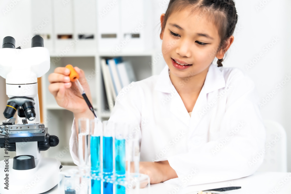 young girl in a lab coat uses dropper to conduct a chemistry experiment with blue liquid in test tubes. The image captures the essence of hands-on learning, curiosity, and scientific inquiry young girl in a lab coat uses dropper to conduct a chemistry experiment with blue liquid in test tubes. The image captures the essence of hands-on learning, curiosity, and scientific inquiry