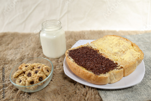 Bread with chocolate choco rice and butter with milk and snack for breakfast	
 photo