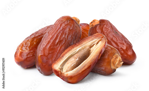 Dried dates fruits with cut in half isolated on white background. photo