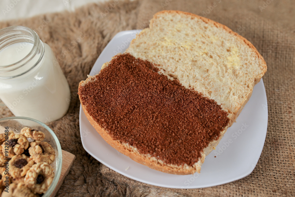 Bread with choco and butter on a plate for breakfast
Bread with choco and butter on a plate for breakfast