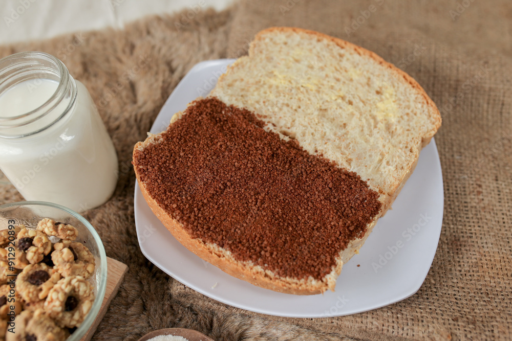 Bread with choco and butter on a plate for breakfast
Bread with choco and butter on a plate for breakfast