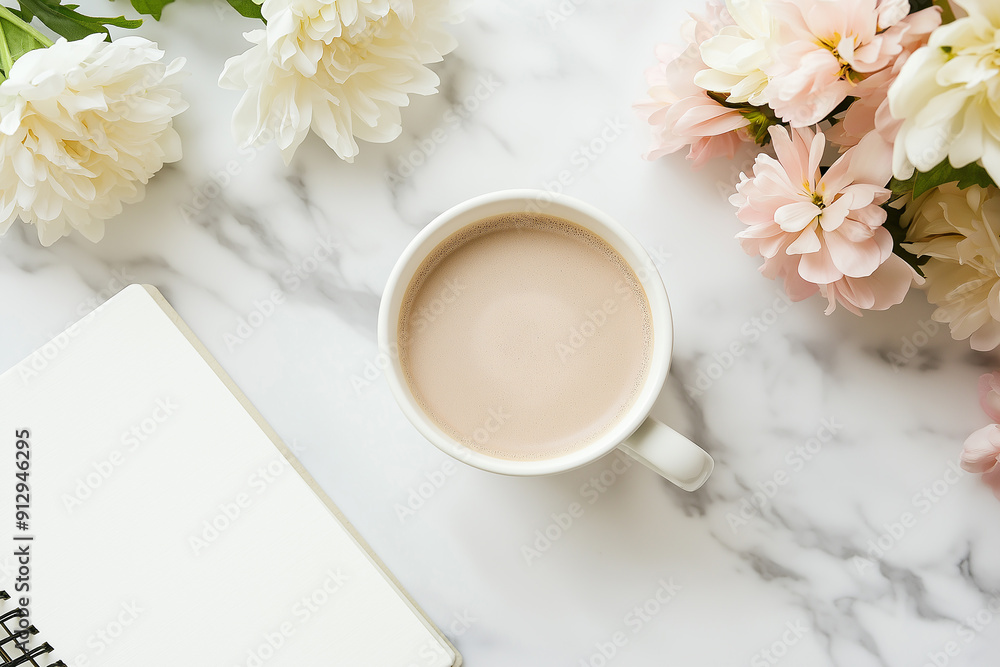 A cup of coffee on a marble surface next to a notebook and flowers, creating a cozy and inviting workspace with a touch of elegance. A cup of coffee on a marble surface next to a notebook and flowers, creating a cozy and inviting workspace with a touch of elegance.