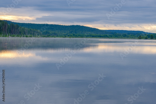 wide river and forest on the horizon