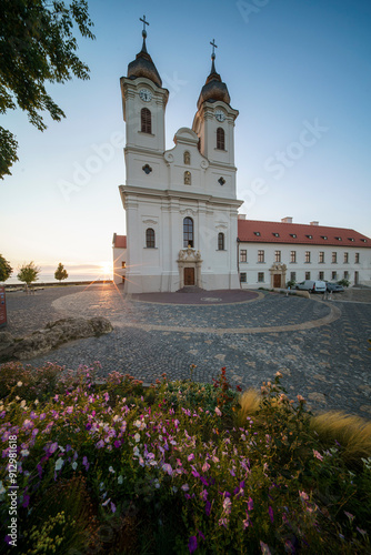 Aerial skyline view of the famous Benedictine Monastery of Tihany (Tihany Abbey) with beautiful colourful sky and clouds at sunrise photo