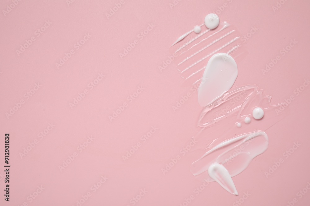 Face cream and gel on pink background, top view. Space for text Face cream and gel on pink background, top view. Space for text