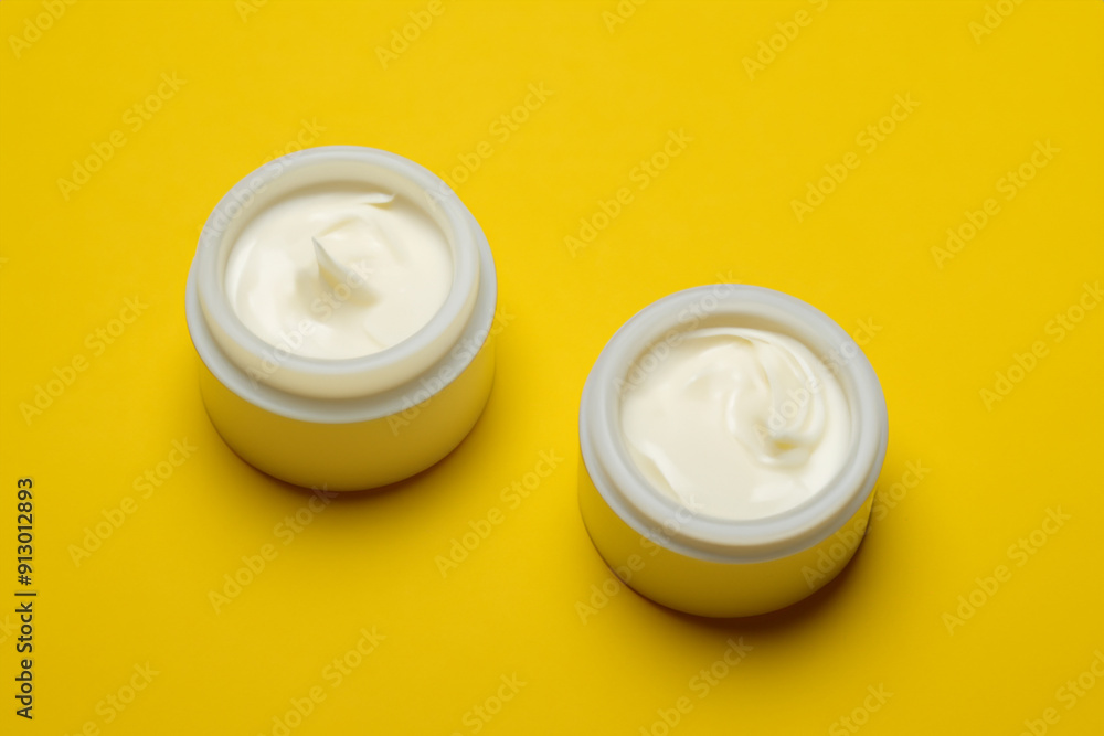 Jars of yellow and cream liqueur on. jar body balm concept. a jar of cosmetics in a yellow . a jar of cosmetics in a yellow and lifestyle cream. Jars of yellow and cream liqueur on. jar body balm concept. a jar of cosmetics in a yellow . a jar of cosmetics in a yellow and lifestyle cream.