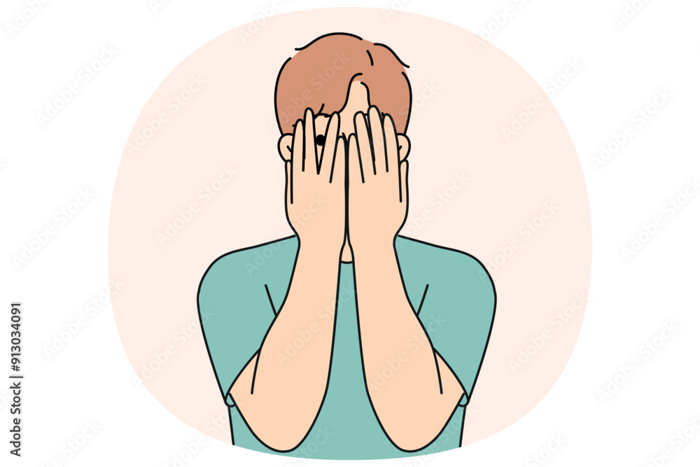 Man closes eyes with hands and peeps, feeling excited in anticipation of surprise or panic after receiving threats. Guy feels insecure and panic, trying to hide from problems that have arisen.