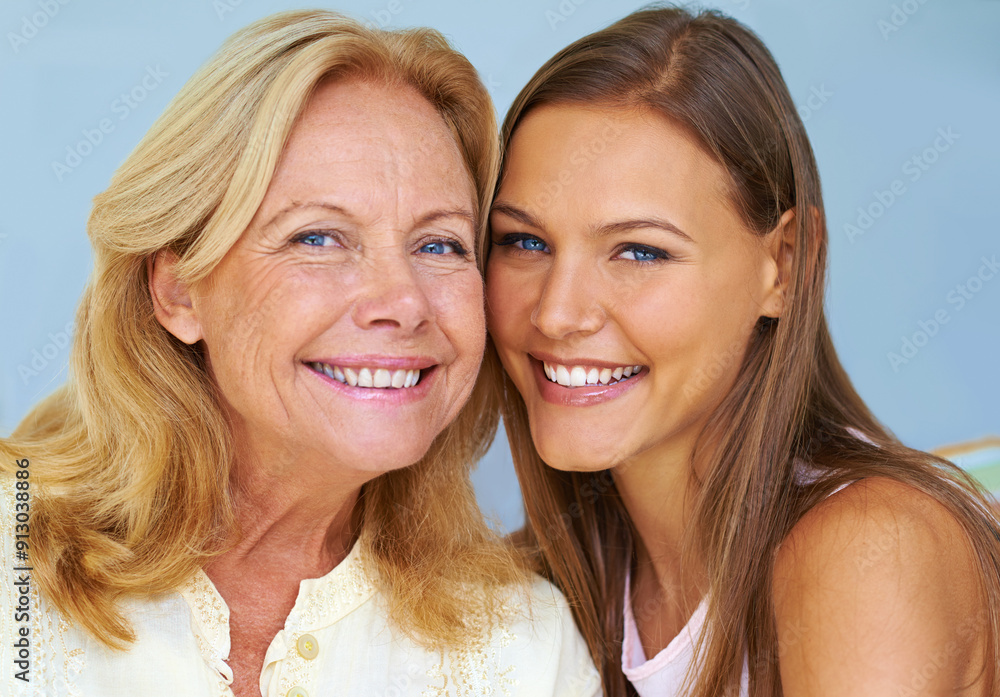 Mother, woman and portrait for bonding in studio, generations and happy on blue background. Mom, daughter and show aging to compare in relationship, smile and parent for affection or love connection Mother, woman and portrait for bonding in studio, generations and happy on blue background. Mom, daughter and show aging to compare in relationship, smile and parent for affection or love connection