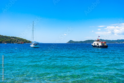 Crystal clear waters of Adriatic Sea around Elaphiti Island Lopud near Dubrovnik. Summer in Croatia photo