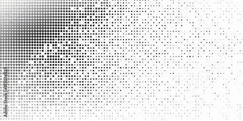 A black and white image of a white background with a lot of dots. The dots are scattered all over the background, creating a sense of chaos and disorder. The image is abstract