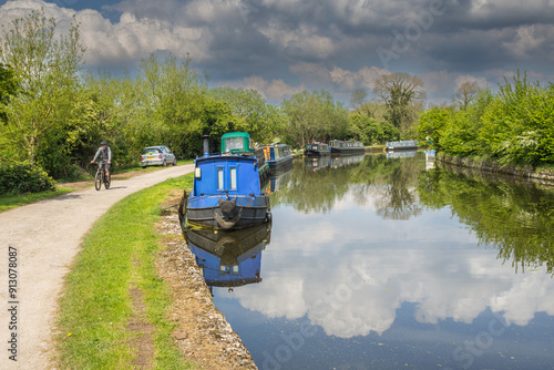 Blue narrowboat on the Leeds Liverpool canal near to Haigh Hall in Wigan photo