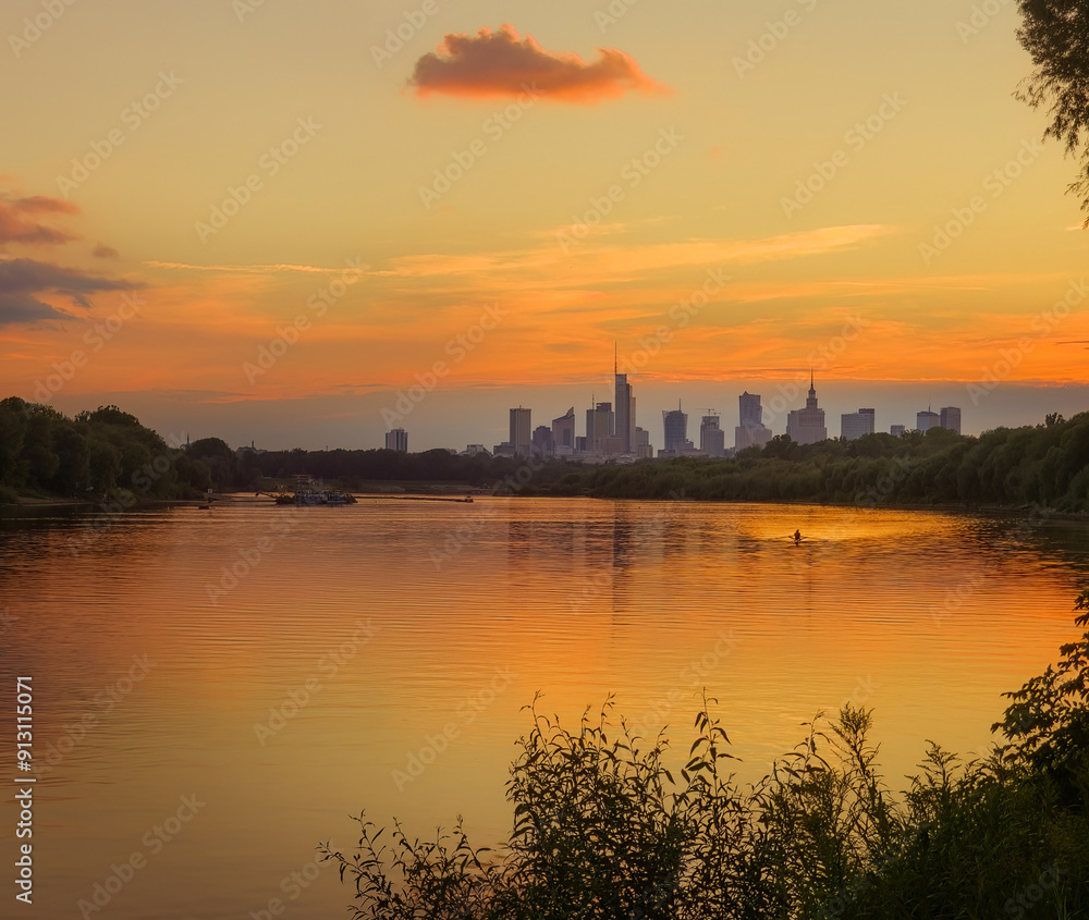 Warsaw skyline seen from the perspective of Vistula river in the colorful sunset. Warsaw skyline seen from the perspective of Vistula river in the colorful sunset.