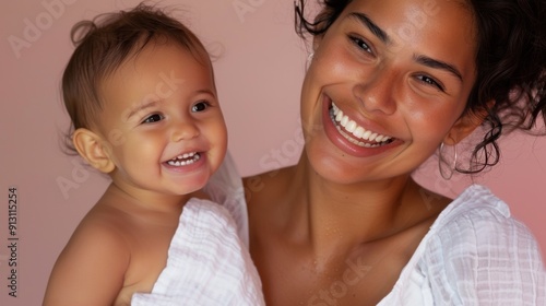 Affectionate interaction of a mother and her delighted baby, showcasing their strong emotional bond.