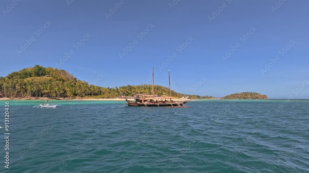 Point of view from a tour boat sailing on islands at sunset. Pov boat sailing to a wild tropical island. Travel holidays tour to the Philippines, El Nido Islands Point of view from a tour boat sailing on islands at sunset. Pov boat sailing to a wild tropical island. Travel holidays tour to the Philippines, El Nido Islands