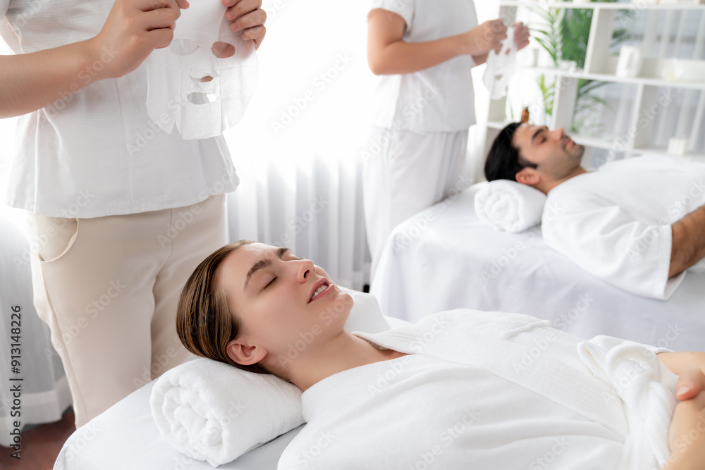 Serene modern daylight ambiance of spa salon, couple customer indulges in rejuvenating with facial skincare mask. Facial skin treatment and beauty cosmetology procedure for face. Quiescent Serene modern daylight ambiance of spa salon, couple customer indulges in rejuvenating with facial skincare mask. Facial skin treatment and beauty cosmetology procedure for face. Quiescent