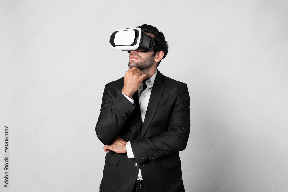 Smart caucasian businessman thinking and planning strategy while using VR glasses. Professional project manager checking financial plan and enter and visit metaverse while wearing headset. Deviation. Smart caucasian businessman thinking and planning strategy while using VR glasses. Professional project manager checking financial plan and enter and visit metaverse while wearing headset. Deviation.