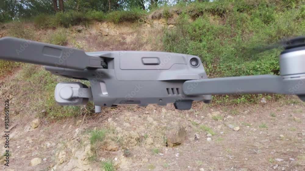 Watch as a drone smoothly descends and lands on the ground with precision. Perfect for projects on aerial photography, technology, and innovation Watch as a drone smoothly descends and lands on the ground with precision. Perfect for projects on aerial photography, technology, and innovation