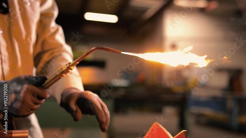 Pipefitter firing up an oxyacetylene torch for brazing
