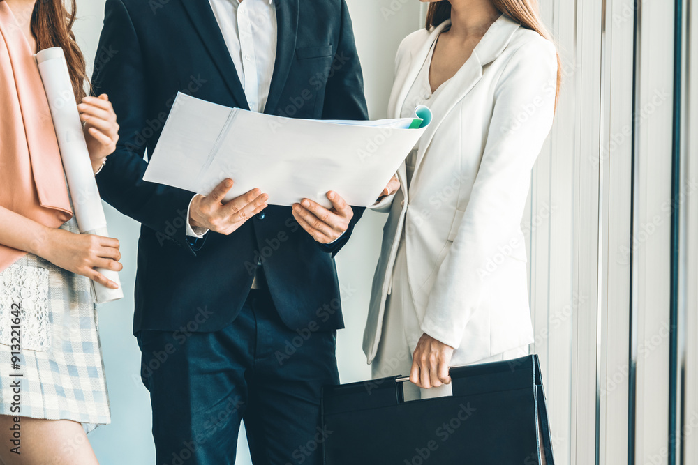 Businessman is in meeting discussion with colleague businesswomen in modern workplace office. People corporate business team concept. uds Businessman is in meeting discussion with colleague businesswomen in modern workplace office. People corporate business team concept. uds