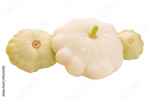three young and fresh white pattypan squashes