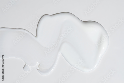 Face cream stroke isolated on white background. White exfoliation cream smear smudge sample. face or body skincare product swatch. showcase of the product