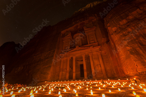 Candles in front of the Pharaoh's treasure house, struck in rock, at night, facade of the treasure house Al-Khazneh, Khazne Faraun, mausoleum in the Nabataean city Petra, near Wadi Musa, Jordan, Asia photo