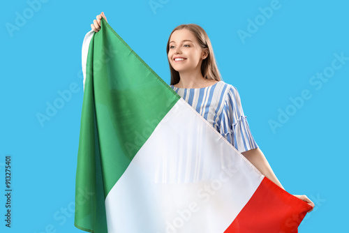 Photography Pretty young woman with flag of Italy on light blue background