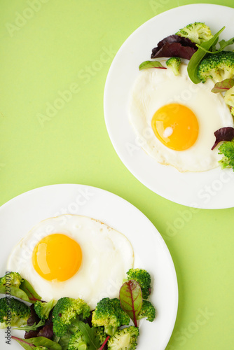 Plates with tasty fried egg...