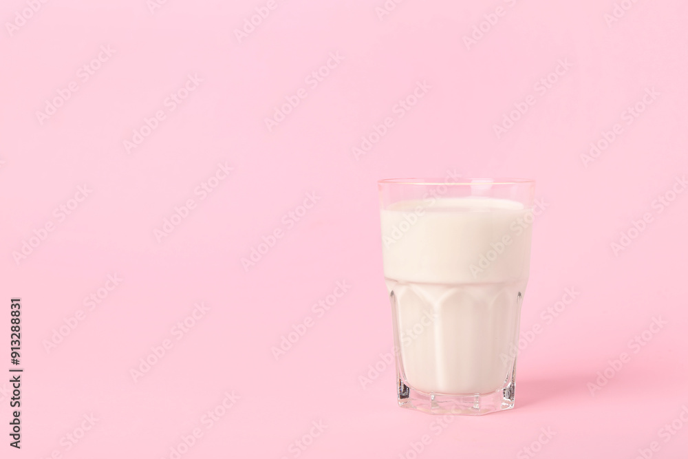 Glass of milk on pink background Glass of milk on pink background