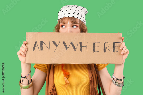 Female hippie holding cardb...