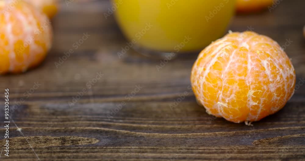 peeled ripe sweet tangerine, mandarin fruit without shell on a wooden blackboard peeled ripe sweet tangerine, mandarin fruit without shell on a wooden blackboard