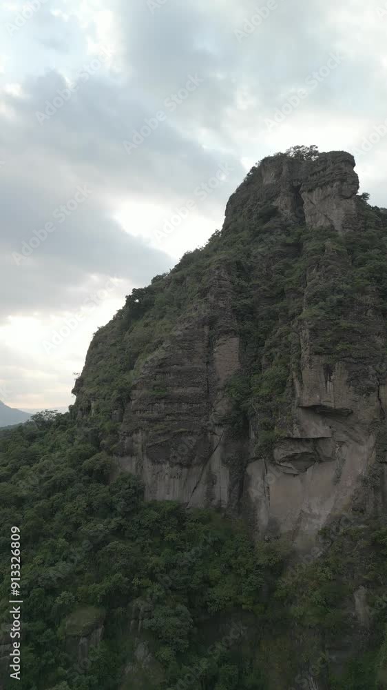 Vertical drone video. Rock formations, forested mountains and large formations. Hiking through the green forest. Hiking concept. Amatlan, Mexico Vertical drone video. Rock formations, forested mountains and large formations. Hiking through the green forest. Hiking concept. Amatlan, Mexico