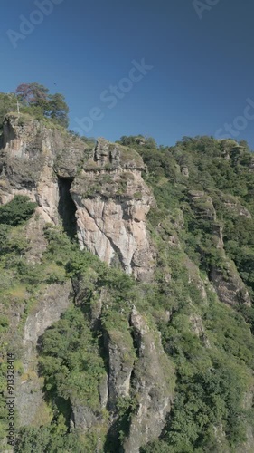 Vertical drone video. Rock formations, forested mountains and large formations. Hiking through the green forest. Hiking concept. Amatlan, Mexico photo