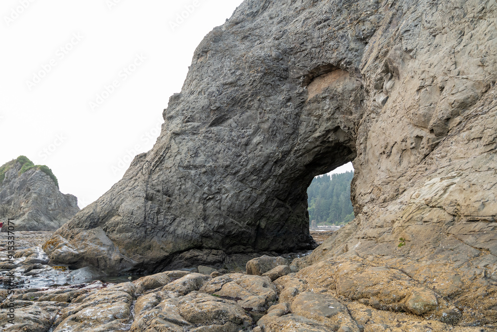 A beautiful view of giant rocks and ocean at Rialto Beach on a cloud day. A beautiful view of giant rocks and ocean at Rialto Beach on a cloud day.